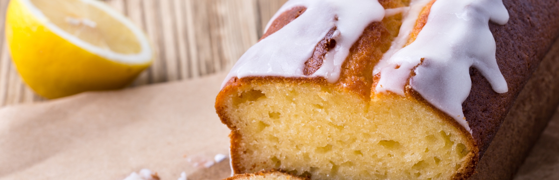 an image of a lemon loaf cake with white icing on top
