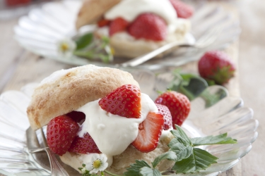 an image of shortcakes with strawberries and cream