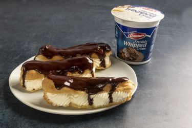 an image of chocolate eclaires and avonmore whipped cream