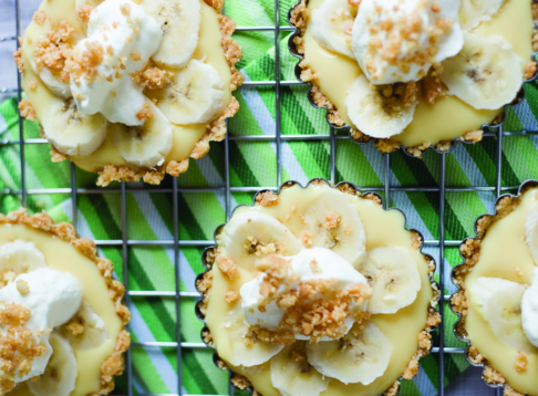 multiple banana tarts on a baking tray